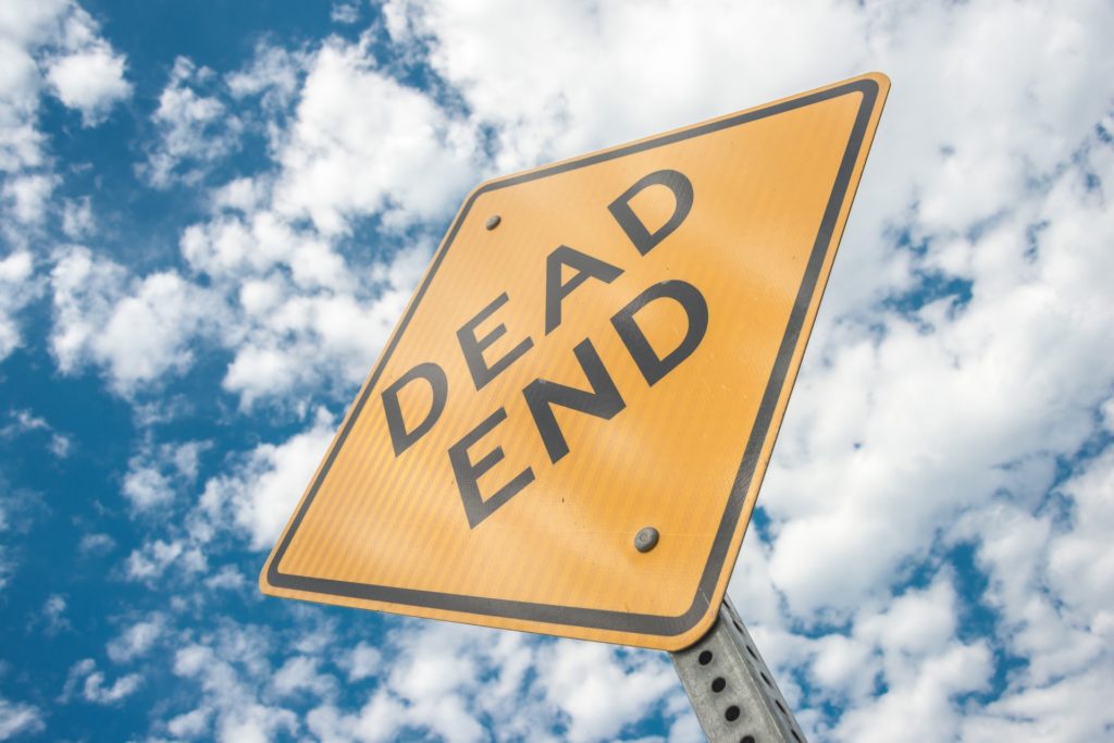 chatbot fails: dead end sign with blue sky and clouds in background. 